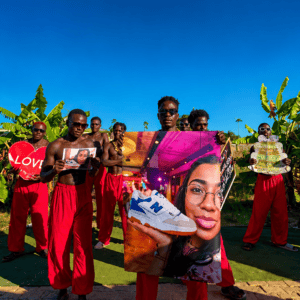 Red Vibes Team performing a Personalized Oversized Photo Video Greeting with custom photo, personal message, HD quality, and worldwide delivery.