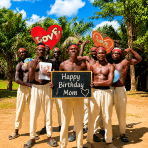 Black Tiger Team holding a personalized happy birthday mom signboard