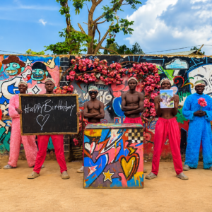 Pink Panther Team performing a personalized Gift Africa video message with a custom message board, optional photo, and vibrant celebration.